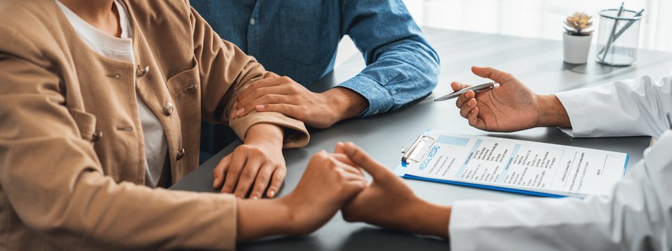 Infertile and medical consultation between young couple and doctor. Neoteric iStock