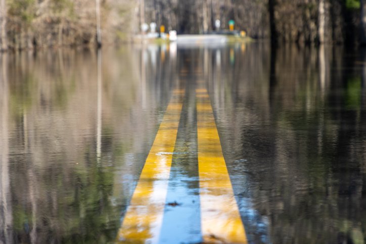 Flooded road underwater after heavy rain storm iStock